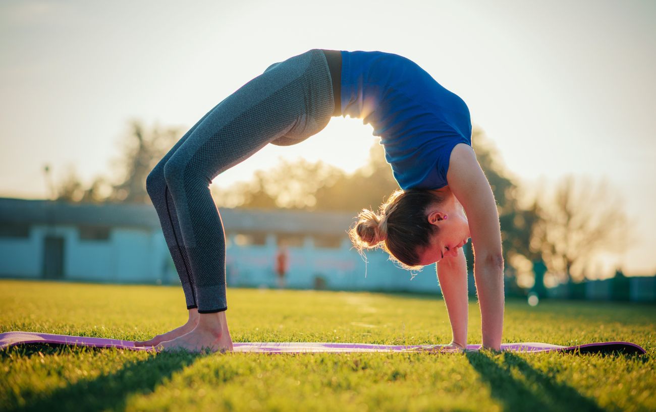 woman in wheel pose