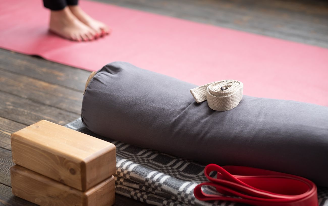 a woman doing yoga with yoga props