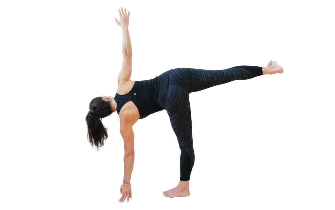 woman doing half moon pose from the back