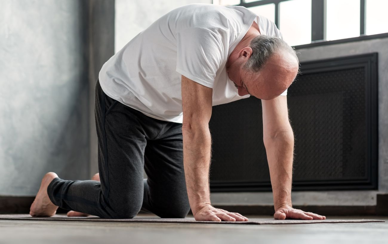 man in table top position