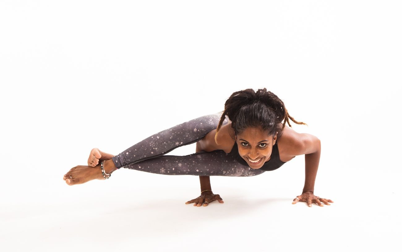 woman doing Ashtavakrasana