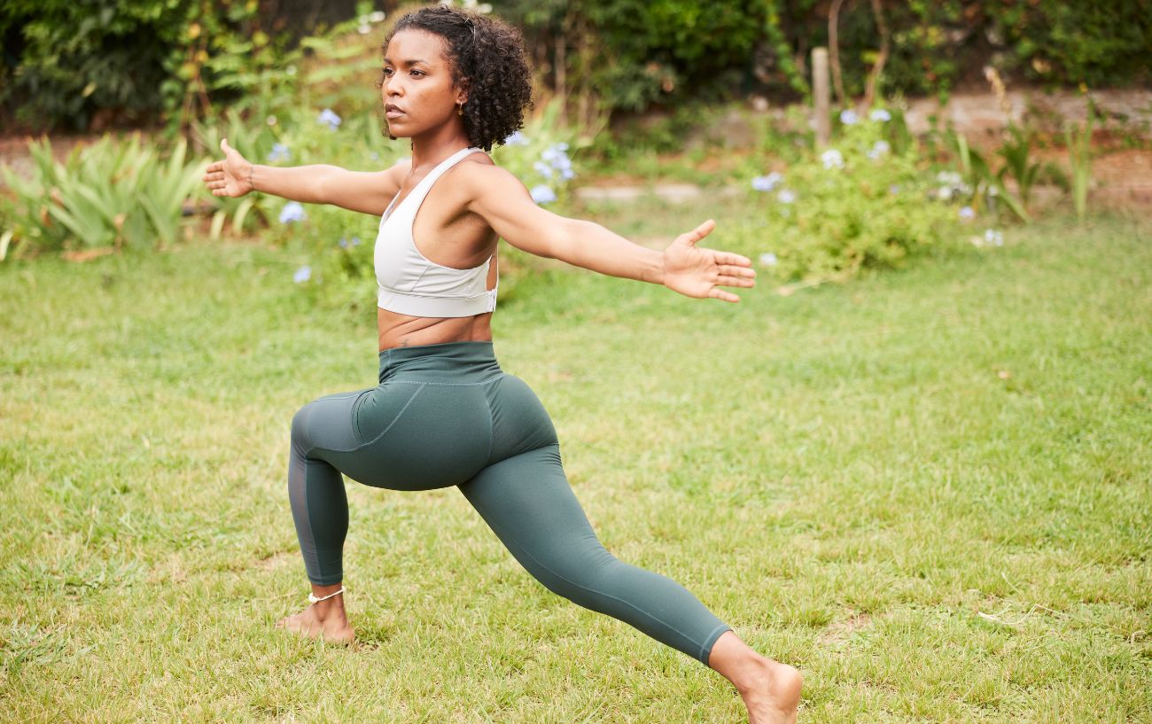 woman doing yoga for gardeners in her garden 