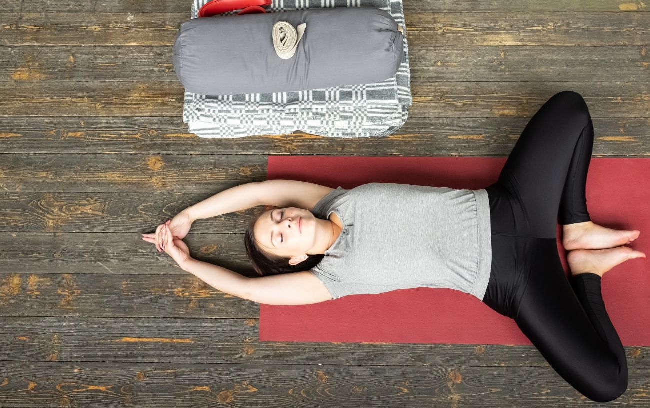 woman in Supta Baddha Konasana