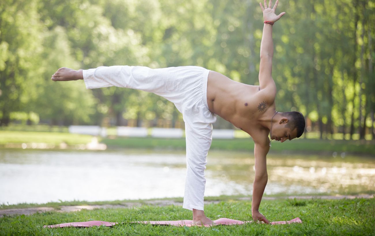 man in half moon pose 