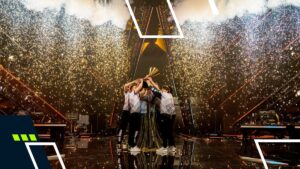 Acend players raising the VALORANT Champions 2021 trophy with fireworks on stage