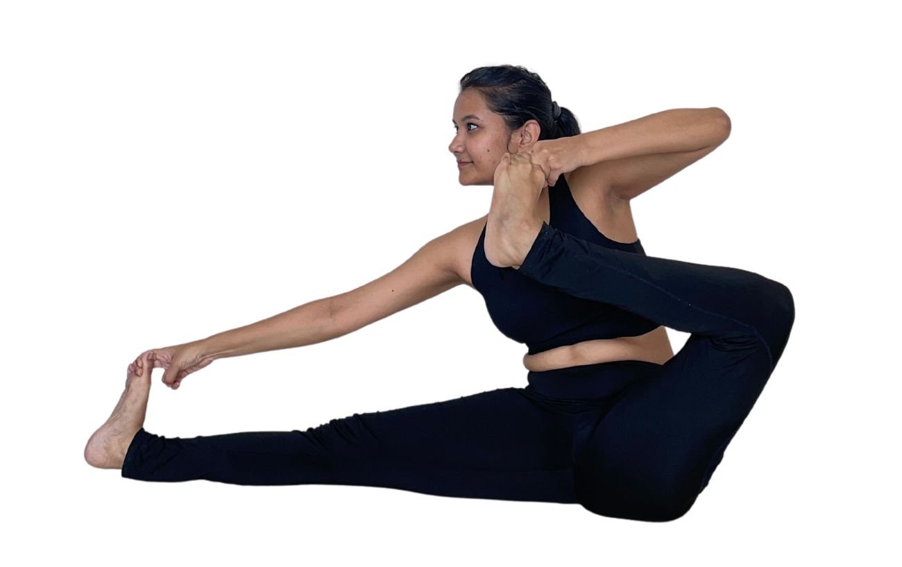 a woman in black yoga clothes doing archers pose