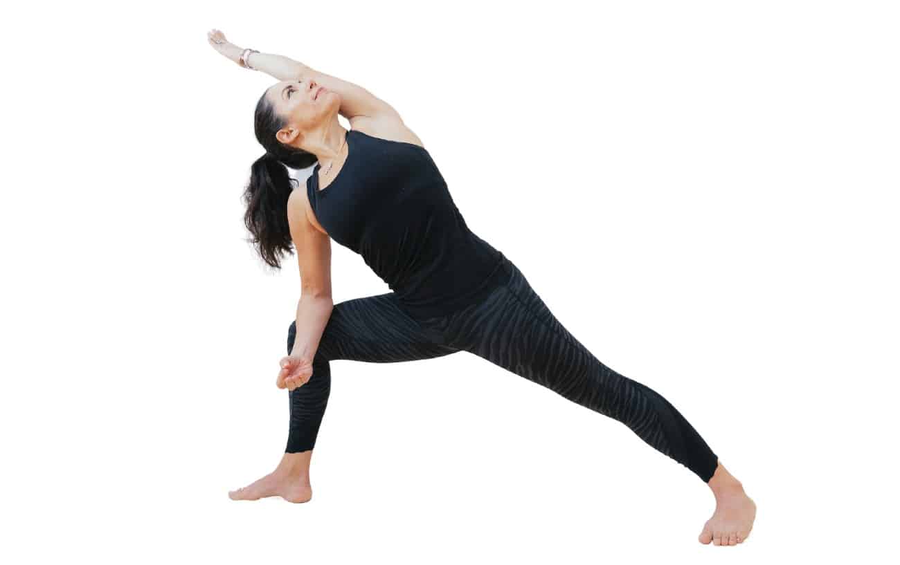 woman doing extended side angle with elbow resting in knee facing forward