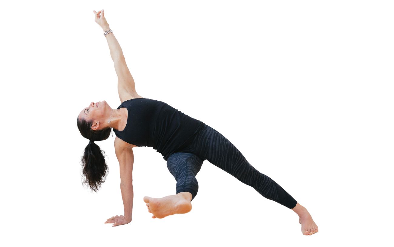 a woman wearing black yoga clothes doing fallen triangle pose with her leg lifted