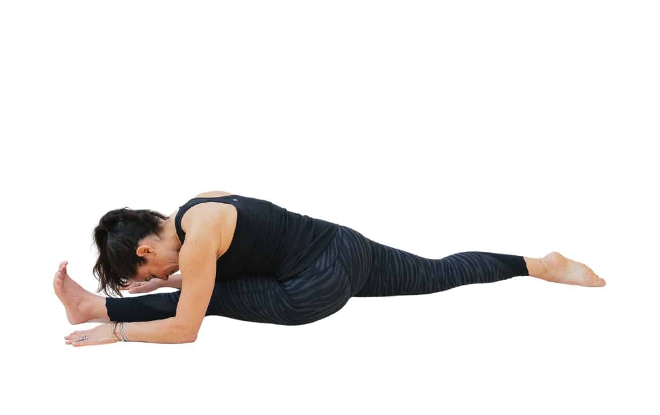 woman doing front split with forward fold yoga pose