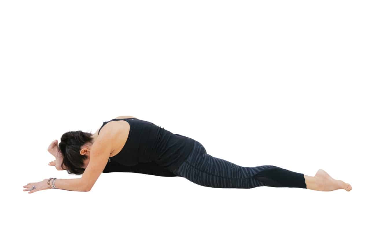 woman doing front split with forward fold wearing black doing yoga