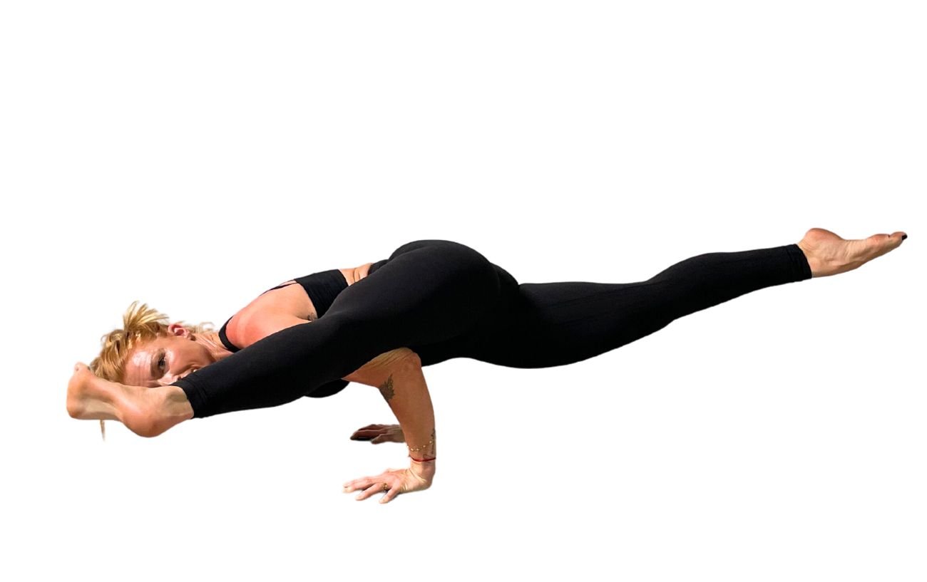 a woman wearing black yoga clothes doing Eka Pada Koundinyasana 2