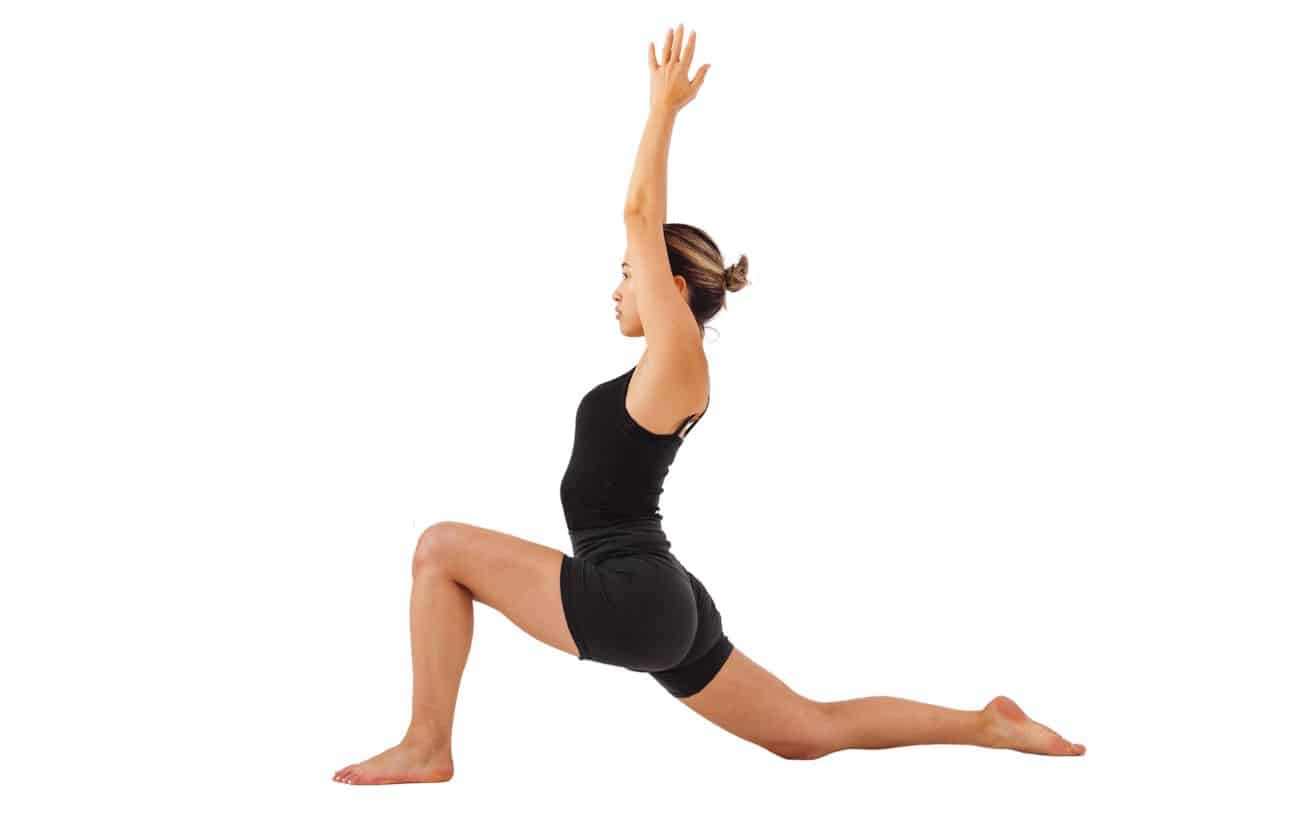 a woman wearing black yoga clothes doing low lunge pose