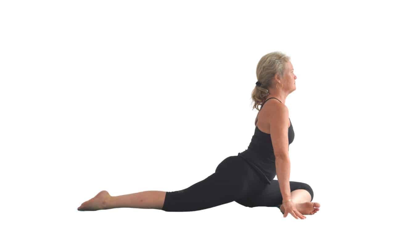 woman doing a swan pose (Ardha Kapotasana)