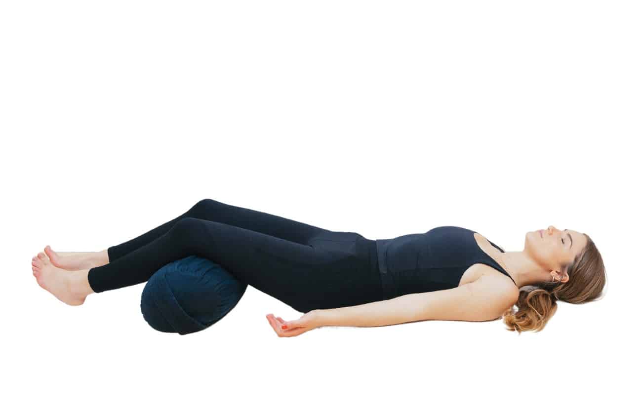 savasana with bolster under knee