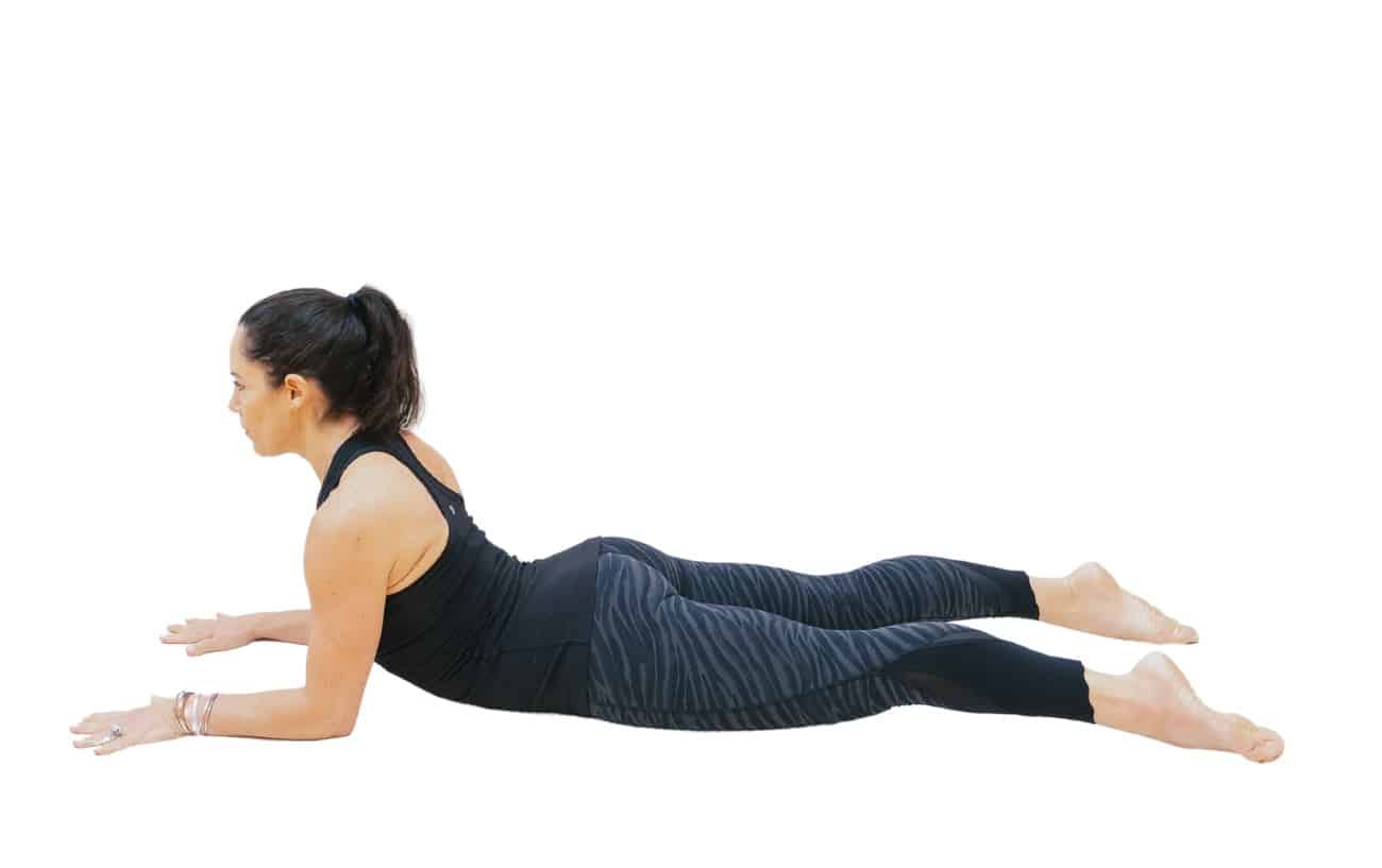 a photo of a woman in Sphinx Pose