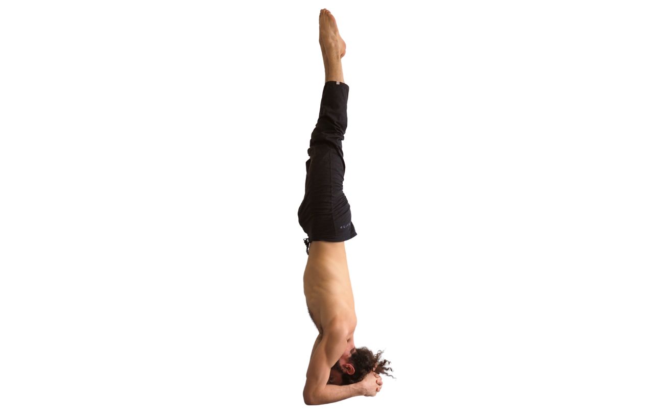 a man doing supported headstand