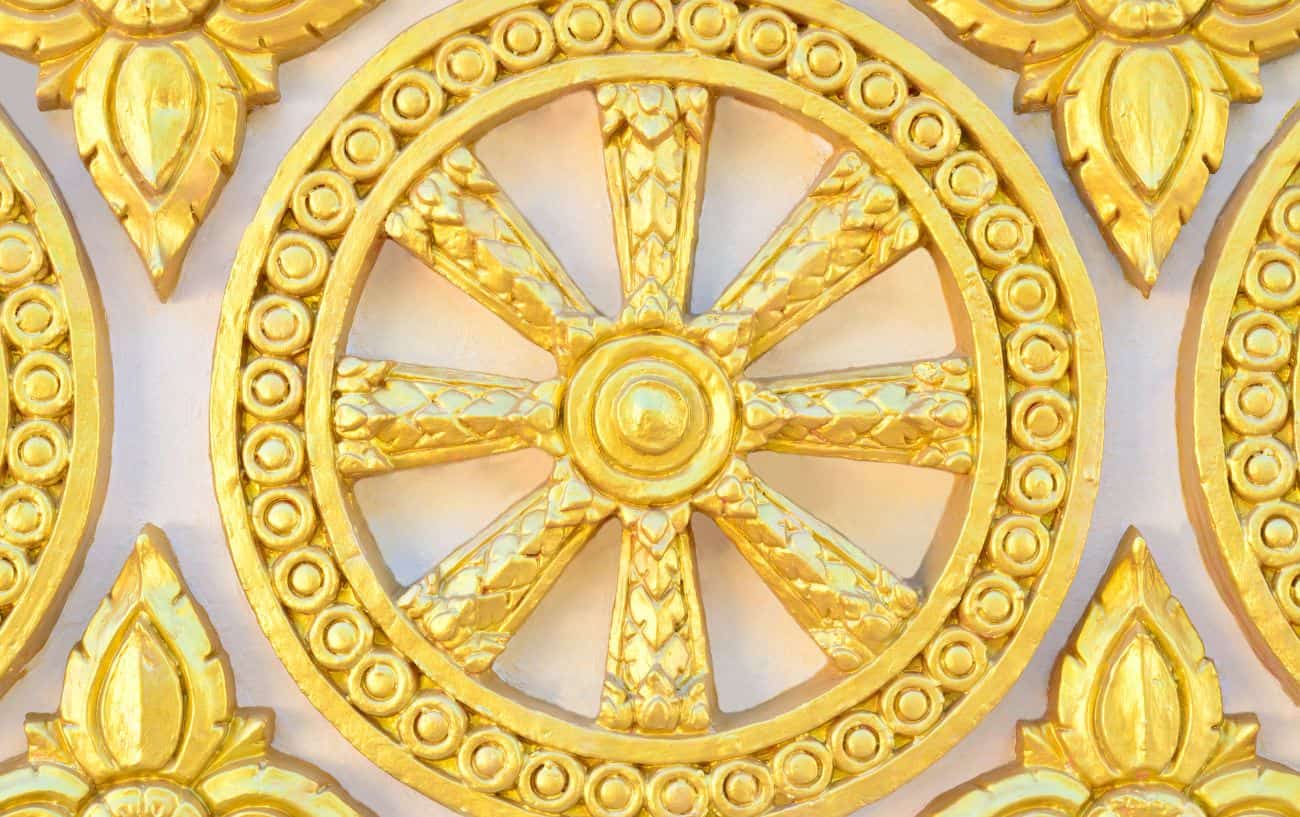 a golden wheel of life sculpture