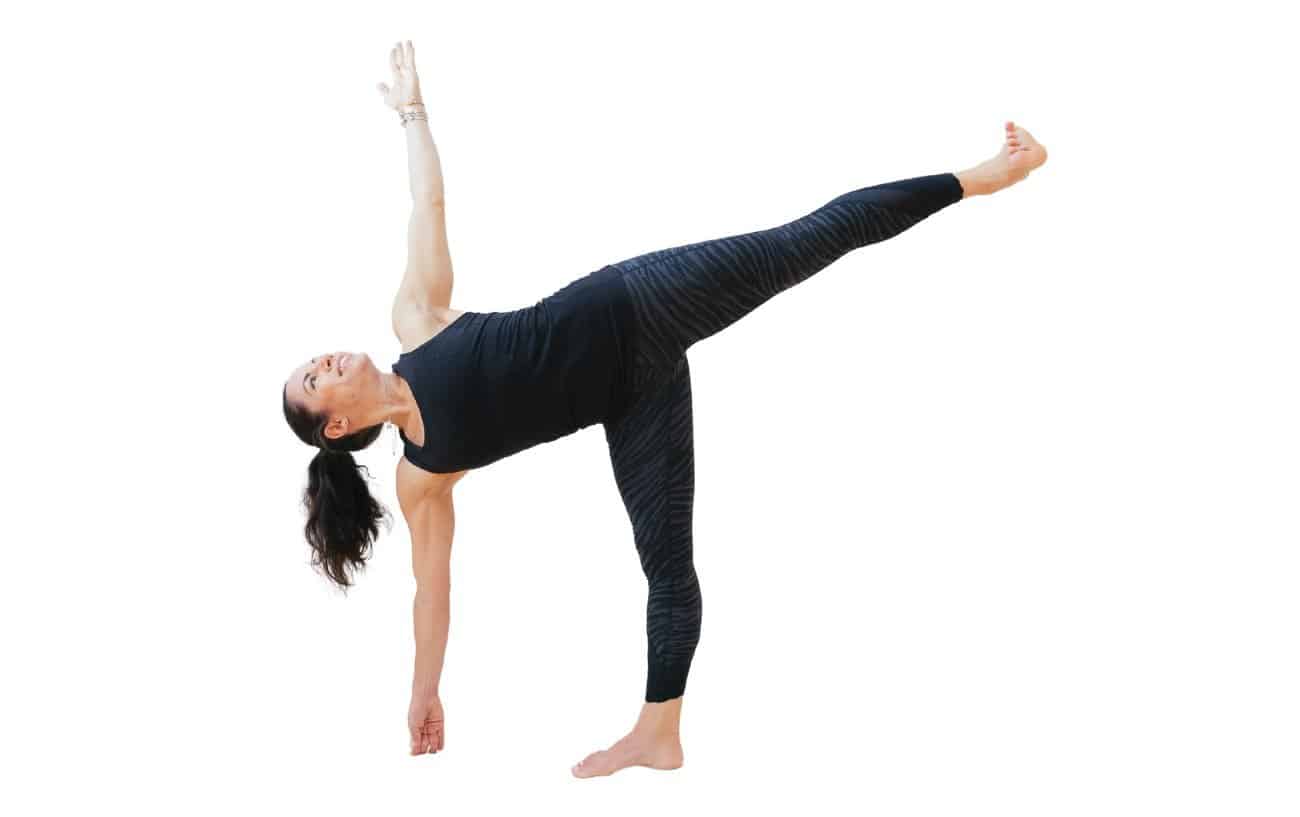 woman doing half moon pose