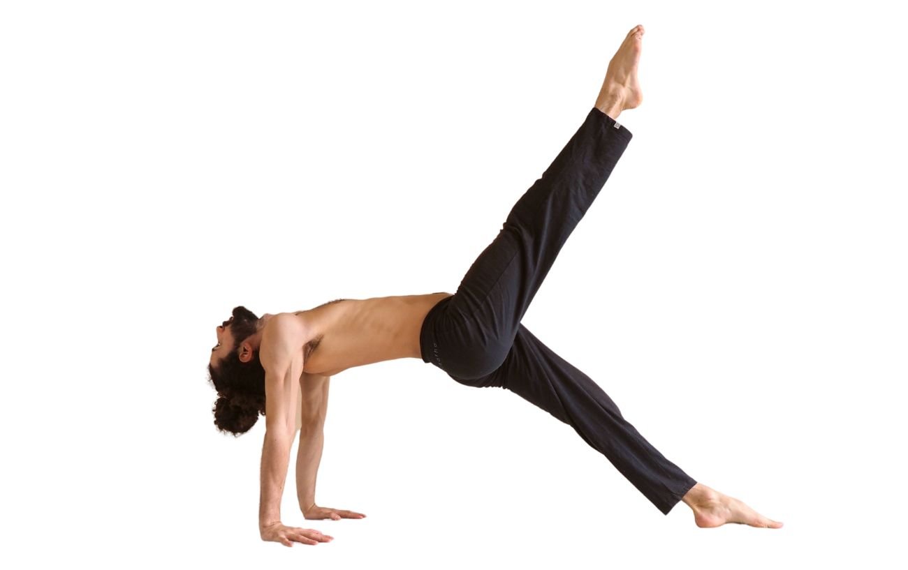 a man wearing black yoga trousers doing one legged upward plank pose