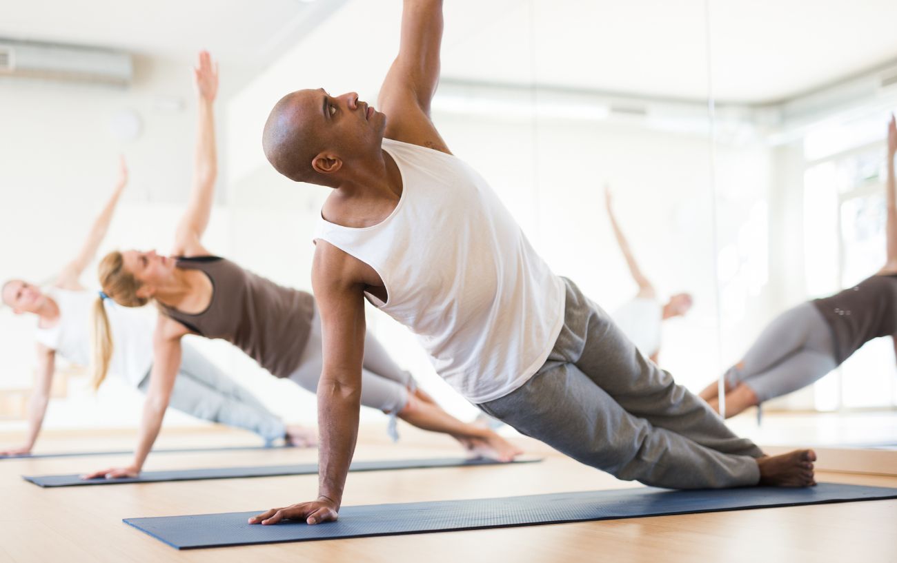 a hatha yoga class in side plank