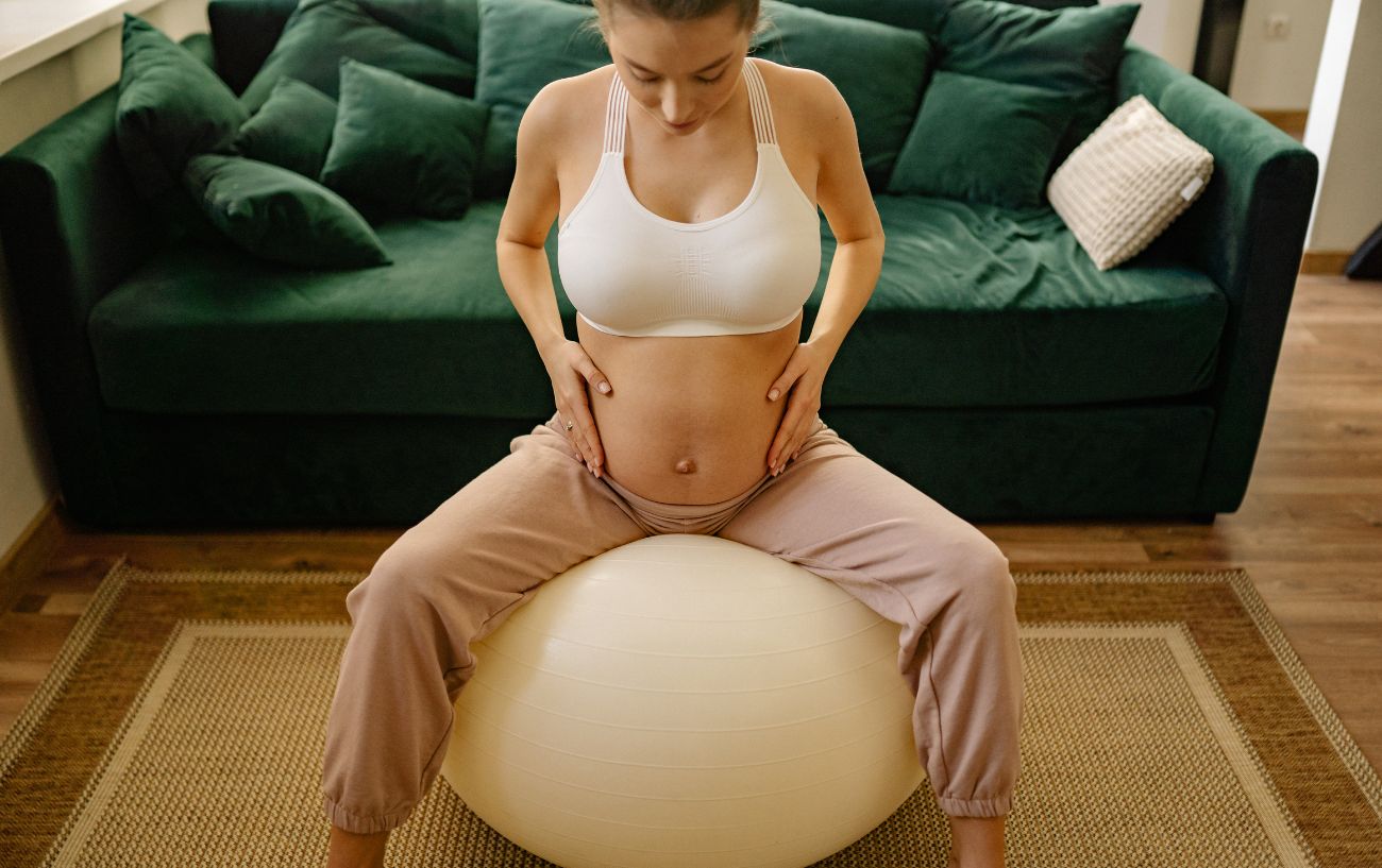 a pregnant woman on a ball