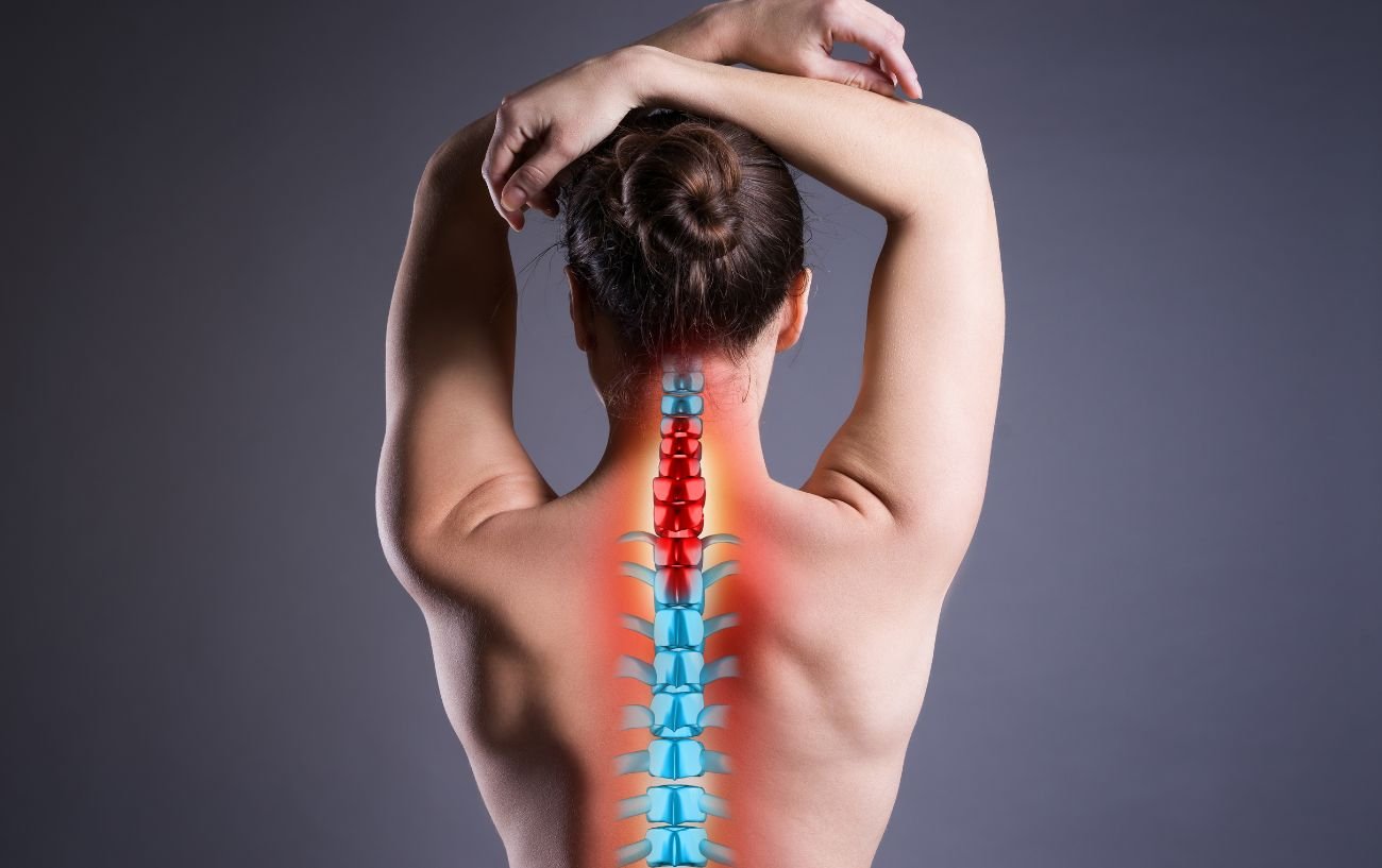 A spine illustration over a woman's back.